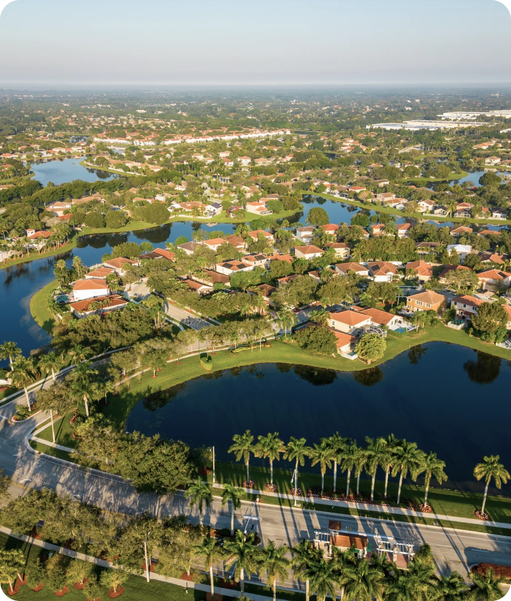 Aerial view of suburban neighborhood with lakes.