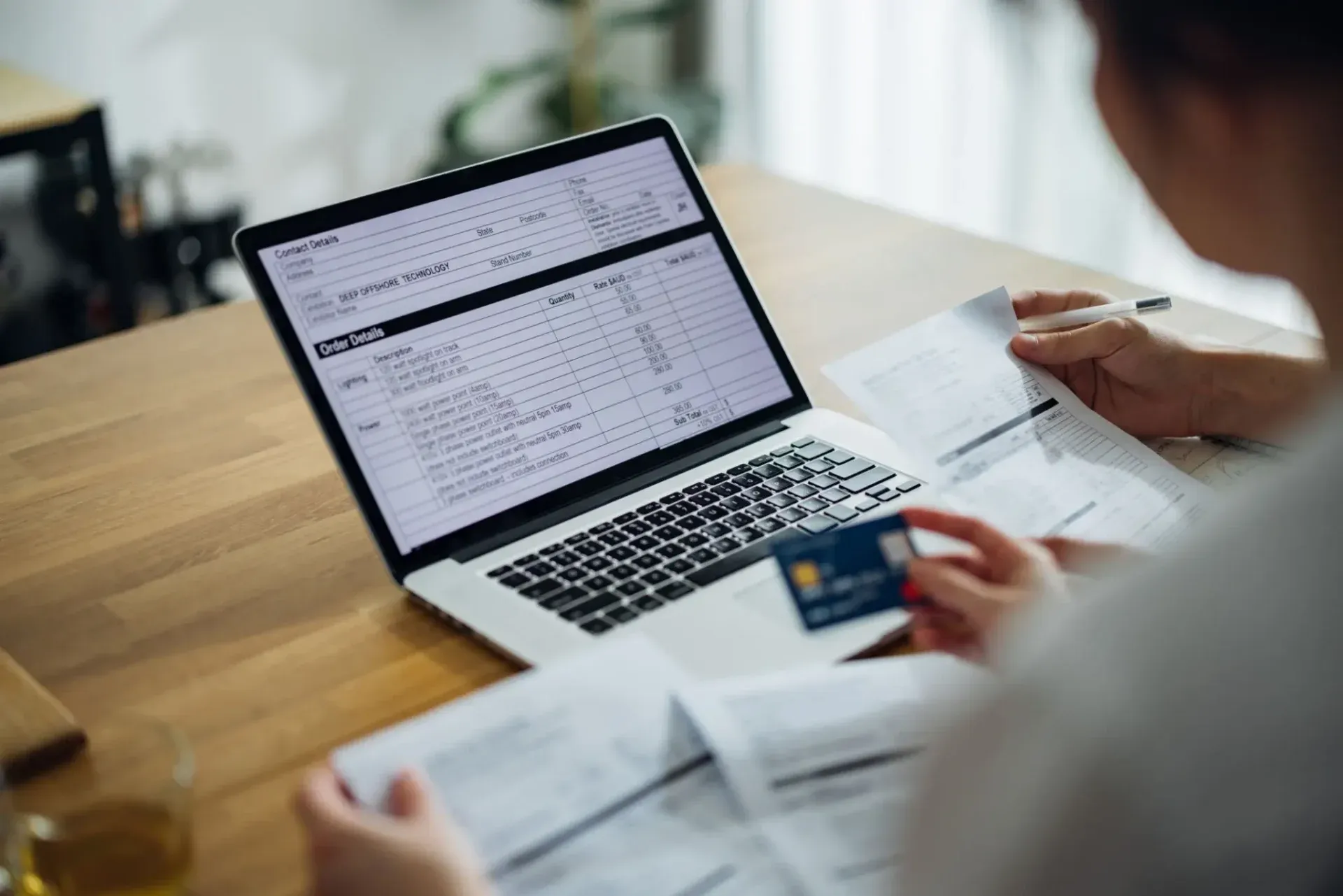 Online banking with credit card in hand